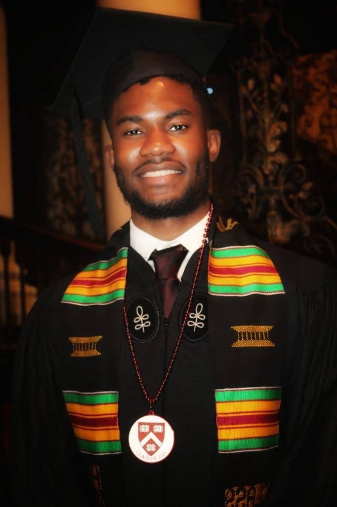 Randy in a cap and gown at his college graduation.