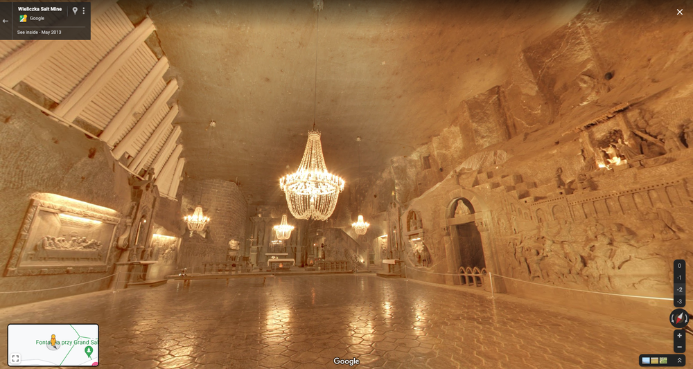 Street View image of an empty chamber with a large chandelier