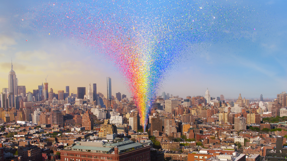 Illustration of the New York City skyline with a rainbow of small squares bursting out of an area of the city where the Stonewall Inn sits