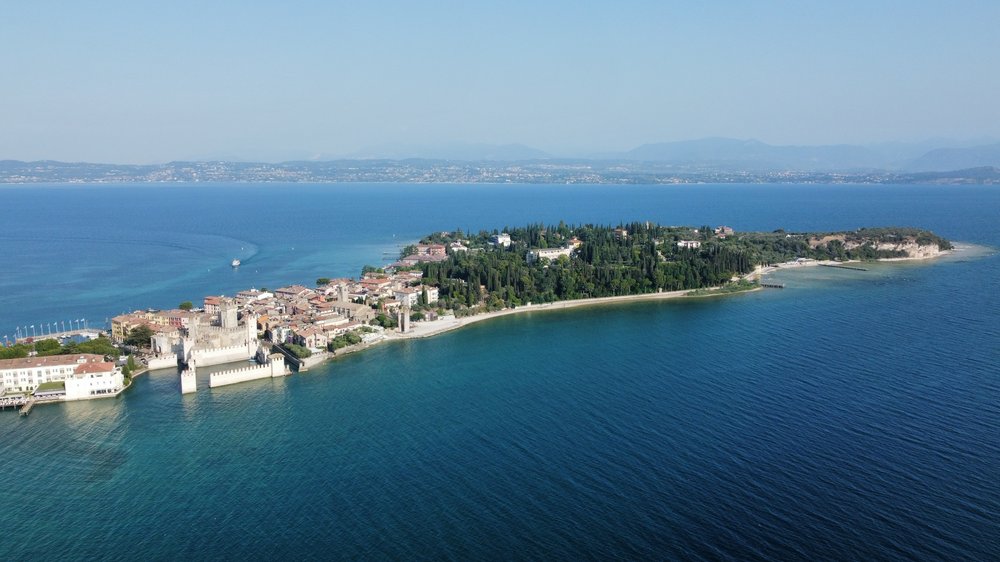 An aerial photograph of a town surrounded by water.